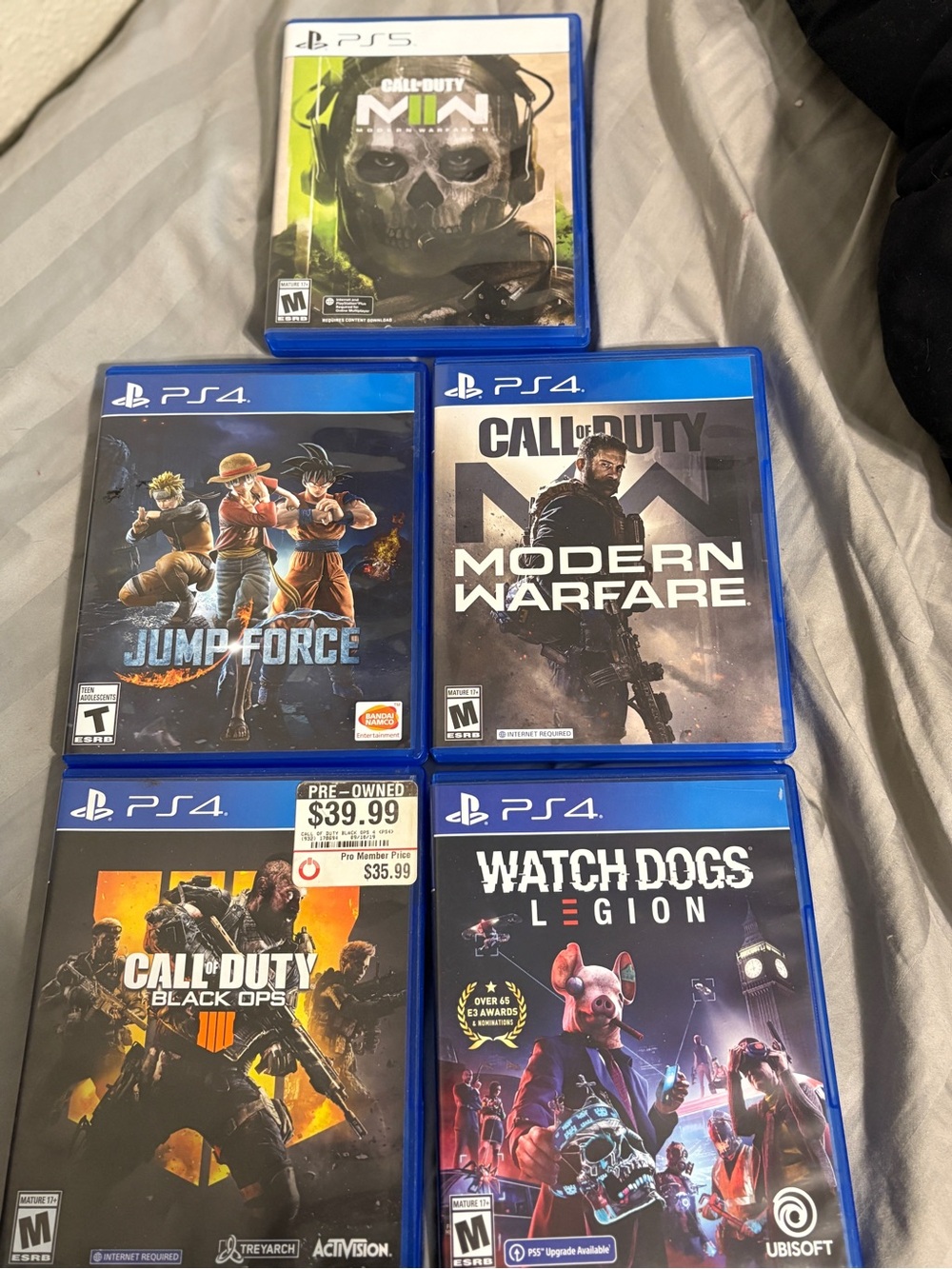 Sony PS4/PS5 Game Lot with Blue Cases - Call of Duty, Watch Dogs, Jump Force